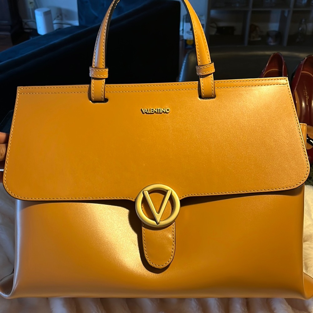 Valentino briefcase/bag with strap and dust bag.